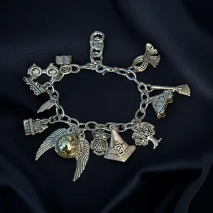 Silver tone charm bracelet with assorted charms thumbnail 1
