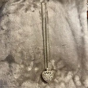 Silver colored heart locket necklace filled with rhinestones in the front side thumbnail 3