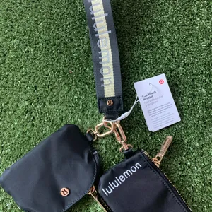 Lululemon Black Gold dual Pouch wristlet thumbnail 1