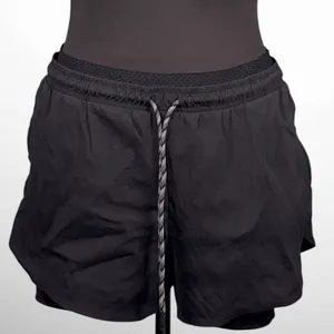 Women’s Athleta Crest 2 in 1 Hiking Shorts Black Size 10 thumbnail 1
