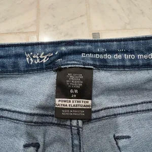 Women’s Distressed Mid-Rise Skinny Jeans thumbnail 4