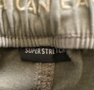 American Eagle -ARMY GREEN JOGGER PANTS-SIZE 2 Elastic waist with drawstring, zip front, two front and two back pockets, elastic ankles with a side zipper, excellent condition Measurements: Waist: side to side 13-16 inches Rise: 9 inches Inseam: 37 inches thumbnail 12