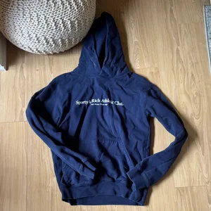 Sporty & Rich Navy Hoodie thumbnail 1