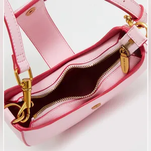 CHARLES & KEITH’s Limited-edition collaboration ITZY Gabine hobo saddle bag. thumbnail 7