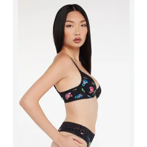 Savage X Fenty Cotton Essentials Unlined Bra Lace Bad Butterfly Black Size S Breathable Fabric: Soft and stretchy signature cotton-jersey body construction for comfortable, all-day lounge or streetwear wear.Unlined Support: Features lightweight, unlined 3-layer underwire cups and supportive wings designed to hug and lift your natural shape without extra bulk.Signature Details: Finished with delicate, tonal scalloped logo lace trim running along the cups.Custom Fit: Features fully adjustable shoulder straps and a classic hook-and-eye back closure with tonal nylon-coated hardware.Materials: Body is 95% Cotton, 5% Elastane; Delicate Lace trim is 82% Polyamide, 18% Elastane.Care Instructions: Hand wash cold, lay flat to dry. thumbnail 4
