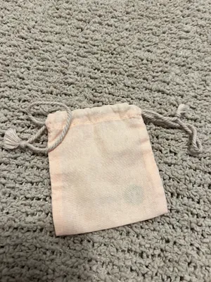 Lightweight blush pink pouch with Gorjana logo. Drawstring closure keeps contents secure. Soft fabric for small jewelry and accessories. thumbnail 2