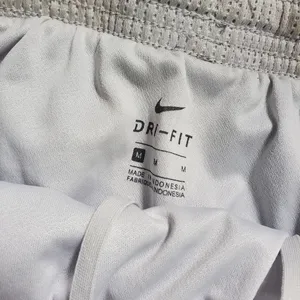 Nike gray Athletic shorts size Medium women's , running shorts dri fit thumbnail 4