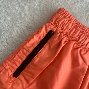 Women’s Nike Mesh Lined Woven Shorts Neon Orange Loose Fit DA6166-858 - Size Medium thumbnail 4