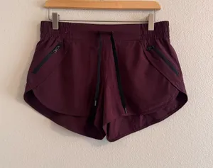 ZYIA Women's Deep Plum Athletic Shorts with Zip Pockets thumbnail 1