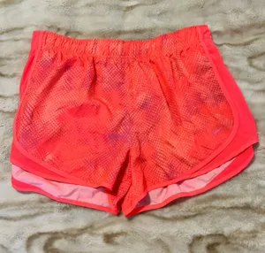 Nike Women’s Neon Coral Athletic Shorts thumbnail 1