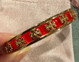 Tory Burch | Gold Plated & Red Enamel Logo Open Bangle Bracelet thumbnail 1
