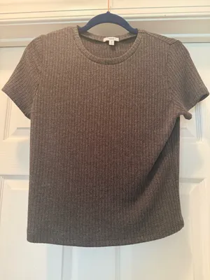 Soft ribbed knit short sleeve top. Crew neckline with fitted silhouette. thumbnail 1
