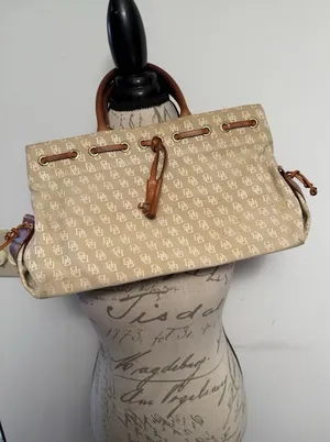 Dooney and Bourke Beige Canvas and Leather Signature Tassel Tote Handbag‎ thumbnail 1