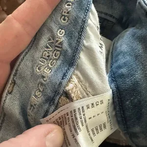 American Eagle destroyed curvy super high rise 4 crop short jeggings thumbnail 2
