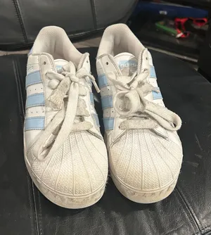 adidas White Sneakers with Light Blue Stripes thumbnail 1