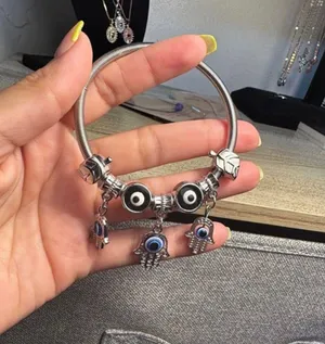 Silver bracelet with evil eye charms. thumbnail 2