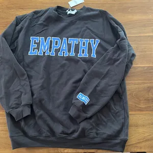Mayfair Group Empathy Black Sweatshirt by ALMST thumbnail 1
