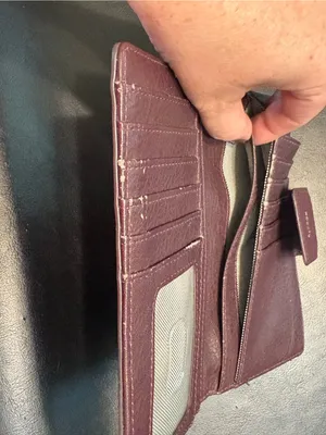 Fossil pebbled leather tab clutch wallet in a deep burgundy or berry color thumbnail 8