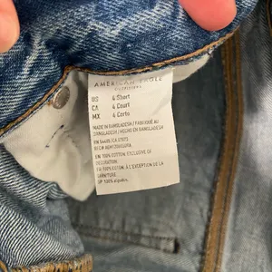 EUC American Eagle women’s medium‎ wash distressed hem short jeans size 4 thumbnail 8