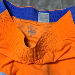 Nike Dri-FIT Womens Size Medium Running Shorts Orange‎ Blue Athletic Gym Workout thumbnail 7