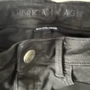 American Eagle Outfitters black distressed mid rise jegging size 8. thumbnail 5