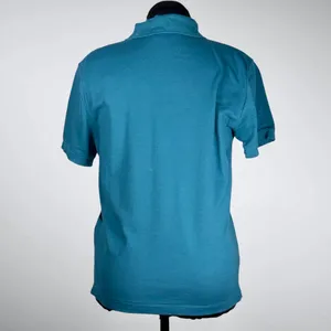 Women’s Athleta 5 Button Teal Pique Polo Size Medium NWT thumbnail 2