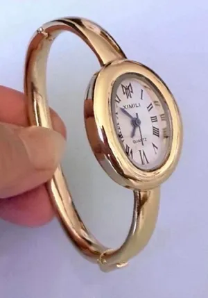 Brand New y2k style gold bangle watch with white face and Roman numerals thumbnail 1