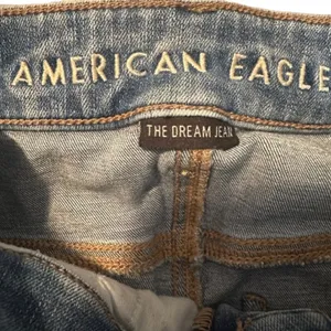 American Eagle Women’s Blue Distressed Shark Bite Fringe Denim Jeans Size 0R thumbnail 10
