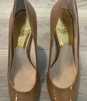Michael Kors women’s pumps size 10.5. The right shoe has tear towards the toe. thumbnail 1