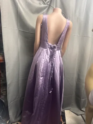 New size 14, beautiful dress has a tail in the back and a big flower in the front thumbnail 3