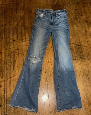 American Eagle distressed 0 hi-rise flare raw hem jeans thumbnail 1