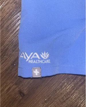 Figs women’s ceil blue scrub top with Aya Healthcare logo thumbnail 2