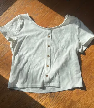 A white t with buttons going down Size M thumbnail 1