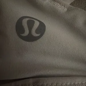 white lulu sports bra! barely worn, great condition! size 0! comes with pads! originally $48, selling for $25! ! thumbnail 3