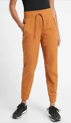 Women’s Athleta Trekkie North Jogger Pants Rust Orange Cattail Brown Size 10 thumbnail 1