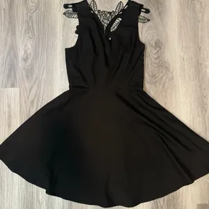 Altar’d State size Small fit and flare black mini dress with lace detail on back thumbnail 1