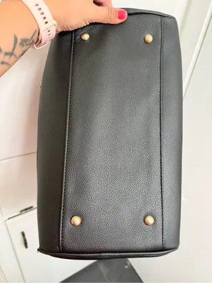 black woven duffle bag with gold hardware, some wear in the handles, no brand. thumbnail 5