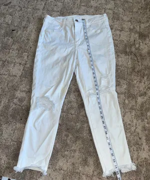 American Eagle White Distressed High-Waisted Jeans with Frayed Hem size 14 thumbnail 1