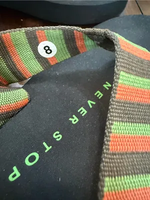 The North Face Size 8 Black Flip Flops with Green, Orange, and Brown Straps thumbnail 3