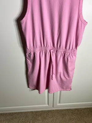 Soft pink sleeveless one-piece with an adjustable drawstring waist for a comfortable fit, with pockets. Lightweight cotton-blend fabric designed for easy movement. Simple, versatile style that pairs well with sneakers or sandals. Member’s mark size large. 57% cotton, 38% polyester, 5% spandex thumbnail 3