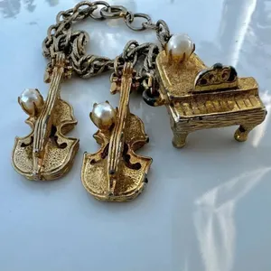 Vintage gold tone faux pearl instrument charm bracelet thumbnail 2