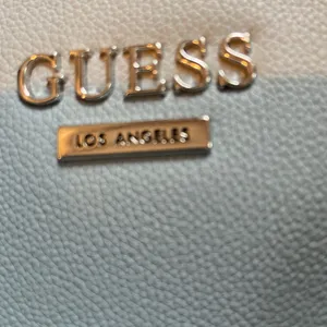 GUESS. Lt blue color! PURSE Vogue lanky chain handle! Near new. thumbnail 6