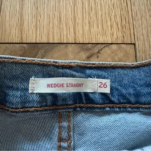 Levi’s Wedgie Straight High Rise Blue Jeans with Frayed Hem thumbnail 3