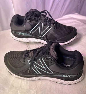 New Balance Black Sneakers with Light Blue Accents thumbnail 1