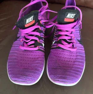 Nike Purple and Pink Flyknit Trainers thumbnail 1
