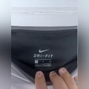 NIKE Women’s Dri Fit Athletic Leggings with Glossy Logo Graphic thumbnail 8