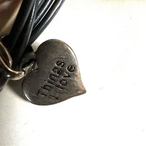 Silver tone double heart pendant necklace on black cord thumbnail 4