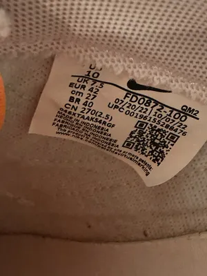 Nike White Low-Top Sneakers with Orange Tongue and Subtle Pink Lining thumbnail 2