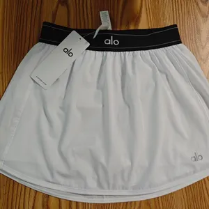 Alo Yoga White High Waist Mini Skort Built-In Shorts thumbnail 1