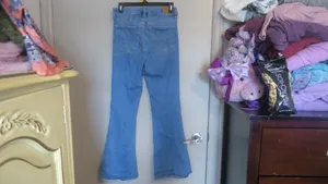 American Eagle Outfitters next level stretch super hi-rise flare jeans in medium wash blue size 4. thumbnail 9